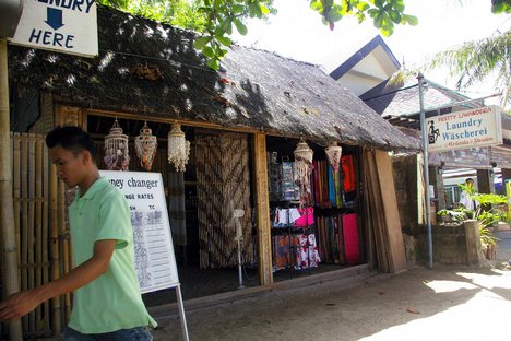 A beachfront store offers a variety of services like forex and laundry, aside from selling sea shells and swim clothes at Boracay Island, Philippines as seen in this March 11, 2009 photo.