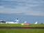 Aircraft on the apron at Leeds Bradford International Airport, Leeds, West Yorkshire, UK. Two Flybe aircraft can be seen, one Thomas Cook and One Jet2.com aircraft can also be seen.