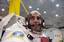 Lt. Cmdr. Chris Cassidy smiles after donning his space suit during zero gravity training at the Neutral Buoyancy Lab (NLB).