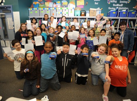 SEATTLE Jaymi Foxs 4th grade class at Talbot Elementary School in Renton, Wash., hold up thank you letters from Coast Guard Base Support Unit Seattle Wednesday, March 31, 2010. The class adopted the unit by sending letters and treats as a way of saying thank you for their assistance during Haitian relief operations. U.S. Coast Guard photo by Petty Officer 3rd Class Tara Molle (821217) ( letters from class )