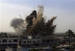 An explosion is seen where the Israeli military is bombing an area around alleged smuggling tunnels in Rafah southern Gaza Strip, Wednesday, Jan. 14, 2009. Israel showed no signs of slowing its bruising 19-day offensive against Gaza's Hamas rulers, striking some 60 targets on Wednesday. Israel launched the onslaught on Dec. 27, seeking to punish the Hamas militant group for years of rocket attacks on southern Israel. The offensive has killed more than 940 Palestinians, half of them civilians, according to Palestinian hospita