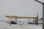 A Shell gas station is covered with snow in Highland, Illinois, USA as seen in this January 11, 2011 file photo.