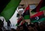 Libyan men join a rally in support of the allied air campaigns against the troops of Moammar Gadhafi in Benghazi, eastern Libya, Wednesday, March 23, 2011.