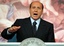 Italian Premier Silvio Berlusconi talks to journalists during a press conference in Rome's Palazzo Chigi, Friday, Sept. 17, 2004. 