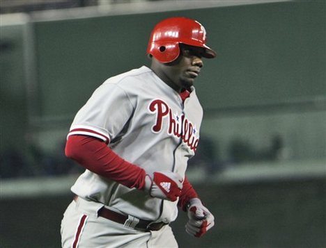 Philadelphia Phillies Ryan Howard rounds third base after hitting a home run in the sixth inning of a baseball game against the Washington Nationals at Nationals Park in Washington, Wednesday, May 21, 2008.