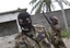 Soldiers loyal to Alassane Ouattara man a checkpoint at one of the principal entrances to Abidjan, Ivory Coast, Tuesday, April 5, 2011.