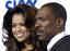 Eddie Murphy mugs for photographers as he poses with his girlfriend Tracey Edmonds at the premiere of the film 