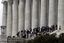 Crowds stand on the steps of the Lincoln Memorial Saturday, April 9, 2011 in Washington.