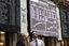 Traders stand by a screen at Madrid's Stock Exchange on Thursday, May 6, 2010.