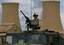 A soldier from the United States 173rd Airborne stands guard at one of the refineries at the Baba Gurgur oil field in Kirkuk, Iraq Thursday, April 17, 2003.