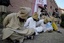 File Pakistani paramilitary soldiers stand guard next to hooded suspect militants captured during an operation in the Akakheil area, to show them to media in Bara, the main town of Pakistan's troubled tribal region Khyber along the Afghan border, Sunday, Dec. 19, 2010.