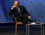 Italian Premier Silvio Berlusconi pretends to talk on the phone as he gestures during the youths People of Freedom party meeting in Rome, Wednesday, Sept. 9, 2009. Thirty women. Eighteen parties. Guests willing to supply sex 