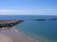 Worm's Head with causeway exposed at low tide flying a para glider over Rhossili Down Following the Norman invasion of Wales, the compote of Gŵyr passed into English hands, the southern part eventually becoming heavily anglicized