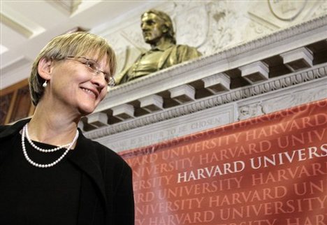 Incoming President of Harvard University Drew Gilpin Faust stands beneath a bust of founder of the university John Harvard after a news conference at Harvard in Cambridge, Mass., Sunday, Feb. 11, 2007. Harvard University has unrivaled wealth and prestige