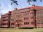 Sever Hall, Harvard University, Cambridge, Massachusetts, USA. Architect H. H. Richardson. Sever Hall, Harvard University (1880), brickwork, with molded brick string courses with turrets embedded in the walls