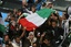 Palestinian Hamas security personnel and foreigners carry the coffin of Italian activist Vittorio Arrigoni during a "state funeral" in Gaza City on April 18, 2011 before the transferring of his body to Egypt via the Rafah border crossing in route to Italy where he will be buried. Arrigoni was found hanged in an abandoned house in the north of the Gaza Strip on March 14, hours after he was kidnapped by a fringe, radical Salafist group. (Photo By Ahmed Deeb/WN)