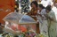 Devotees mourn near the body of Hindu holy man Sathya Sai Baba during a public viewing at the Prasanthi Nilayam Ashram in Puttaparti, India, Monday, April 25, 2011. Thousands of devotees are thronging to the southern Indian headquarters of the revered Hindu guru a day after his death.