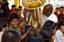 Musician 2nd Class Algie Smith helps a child operate a tuba during a goodwill concert by the U.S. Seventh Fleet Band at the Pattaya Redemptorist School for the Blind.