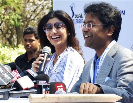 Bollywood actor and Team Rajasthan's new stake-holder Shilpa Shetty, center, and Indian Premier League (IPL) Chairman Lalit Modi, right, participate in an IPL player auction in Goa, India, Friday, Feb. 6, 2009. England's Kevin Pietersen and Andrew Flintoff became the latest members of cricket's get-rich-quick club on Friday, fetching record salaries of US $1.55 million each at the IPL auction.