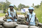 Officers of the UN Operation in Côte d'Ivoire (UNOCI) arrive on the scene after Abidjan’s Hotel du Golf was attacked by forces loyal to former Ivorian President Laurent Gbagbo,  10 April, 2011.