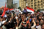 Egyptians shout slogans during a rally to support Muslims and Christians national unity at Tahrir Square, the focal point of the January Egyptian uprising in Cairo, Egypt