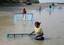 INDIA-VILLAGE-GIRLS-CATCH-FISHVillage girl tries to catch shrimp with help of a mosquito net at Kultali in South 24 Parganas in Eastern India ---- WN/BHASKAR MALLICK