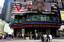 Visitors to New York's Times Square relax under the ABC news ticker announces the arrest of the alleged Times Square bomber Tuesday, May 4, 2010 in New York's Times Square.