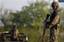 Soldiers stand guard at a crime scene in the municipality of China near Monterrey, Mexico, Tuesday, March 30, 2010. According to the army, two suspected hit men were killed during a shootout with soldiers along the highway to Reynosa after refusing to stop at a military checkpoint.