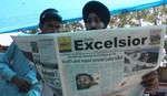 Kashmiri people read newspapers with cover stories of Osama bin Laden, in Srinagar, May 3, 2011. Bin Laden was killed in a U.S. special forces assault on a Pakistani compound, then quickly buried at sea, in a dramatic end to the long manhunt for the al Qaeda leader who had been the guiding star of global terrorism.