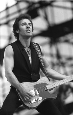 Springsteen performing on the Tunnel of Love Express at the Radrennbahn Weißensee in East Berlin on July 19, 1988.