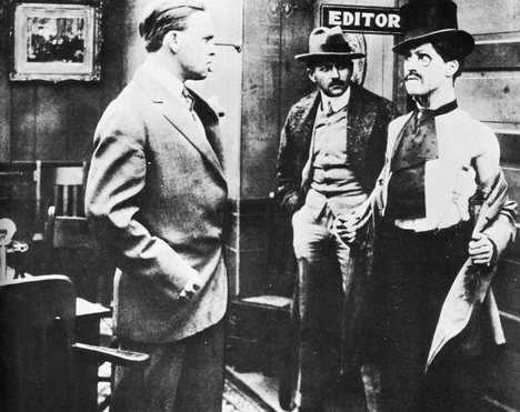 Chaplin on the right in his film debut Making a Living (1914)