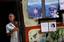 A Cuban man stands in his doorway, in Old Havana, Thursday, July 26, 2007. During a ceremony Thursday marking the the Cuban Revolution´s 54th anniversary, Raul Castro said that Cuba has avoided the collapse predicted by the U.S. since his brother F