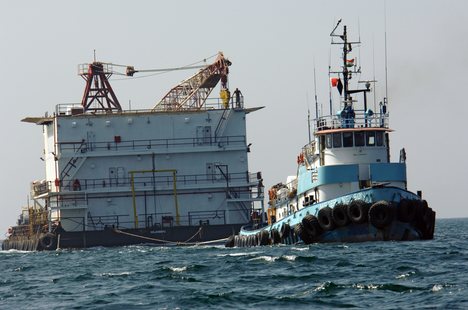 The chartered barge Ocean 6 being towed by tug boat Dona II in the Persian Gulf.