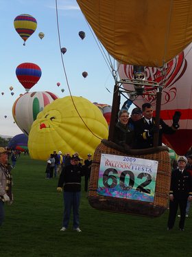 Rear Adm. Paul Bushong, commander of Submarine Group 2, and his wife Dona, lift-off in a hot air balloon at the Albuquerque International Balloon Fiesta.