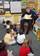 Aviation Boatswain's Mate 1st Class Robert M.P. Roy assigned to the Pre-Commissioning Unit (PCU) George H.W. Bush (CVN 77) reads a Dr. Seuss book to kindergarten students at Newsome Park Elementary.