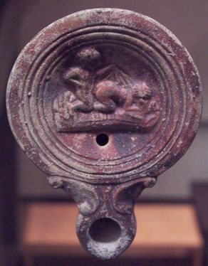 Oil lamp artifact depicting coitus more ferarum.