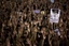 Demonstrators rise their hands as they shout slogans during a protest at Sol square, in Madrid, Friday May 20, 2011.