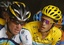 Alberto Contador of Spain, wearing the overall leader's yellow jersey, right, looks at American seven-time Tour de France winner Lance Armstrong, as they climb Grand-Saint-Bernard pass during the 16th stage of the Tour de France cycling race over 159 kilometers (98.8 miles) with start in Martigny, Switzerland and finish in Bourg-Saint-Maurice, Alps region, France, Tuesday July 21, 2009