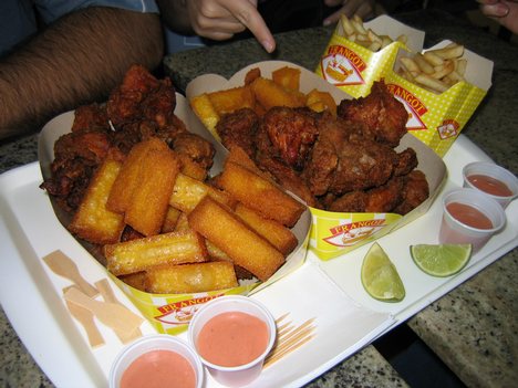 Polenta, French fries, and fried chicken at a Brazilian eatery