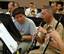 A student finalist in the U.S. Navy Band High School Concerto Competiton, plays oboe alongside oboe instrumentalist Senior Chief Musician Scott Alexaneder in the sail loft on board the Washington Navy Yard.