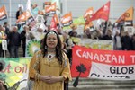 Jasmine Thomas from British Columbia, Canada, talks to members of the media during a protest against BP outside the conference center where BP held its annual general meeting of its shareholders, in London, Thursday, April 14, 2011. BP's annual shareholder meeting got off to a rowdy start on Thursday as crowds of protesters watched over by police held noisy demonstrations outside the venue.(