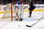 Command Master Chief Mark Rudes tries to block a shot during an exhibition match with the Los Angeles Kings Alumni at the Staples Center.