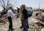 President Barack Obama meets with victims as he views damage from the tornado that devastated Joplin, Mo., Sunday, May 29, 2011.