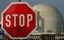 A stop sign stands in front of the nuclear plant of Biblis, south of Frankfurt, central Germany, in this Nov. 4, 2006 file photo. Germany's plan to start shutting down its 17 nuclear reactors as early as the year 2008 is coming under increasing criticism, amid worries about the reliability of gas and oil from Russia and pressure to cut carbon dioxide emissions. Critics say circumstances have changed since a previous government, which included the anti-nuclear Greens, decided on the phased shu