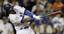 Los Angeles Dodgers' Manny Ramirez hits an RBI single during the fifth inning in Game 4 of the National League baseball championship series against the Philadelphia Phillies