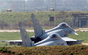 Two British RAF Typhoon jets prepare to take off from Gioia del Colle air base, near Bari, Italy, Thursday, March 24, 2011. NATO's commander for the naval blockade of Libya says he is confident he'll have enough ships to prevent weapons and mercenaries from entering Libya, but says he's still in a "build-up'' phase.