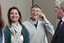 Melinda Gates, left, and husband Bill Gates laugh with Jeff Raikes following speaking at the opening reception of the Bill & Melinda Gates Foundation Thursday, June 2, 2011, in Seattle.