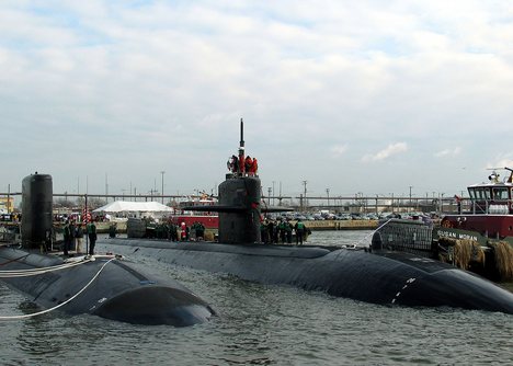 The Los Angeles class attack submarine USS Jacksonville (SSN 699), right, moors alongside USS Hampton (SSN 767).