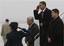 President Barack Obama returns a salute as he steps off Air Force One at Andrews Air Force Base, Md., after he returned from a secret trip to Afghanistan, Monday, March 29, 2010.