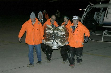 2006/01/17 Stardust Sample Return - The Stardust sample return capsule was transported by helicopter from its landing site at the U.S. Air Force Utah Test and Training Range. This image shows the return capsule inside a protective covering. The capsule,